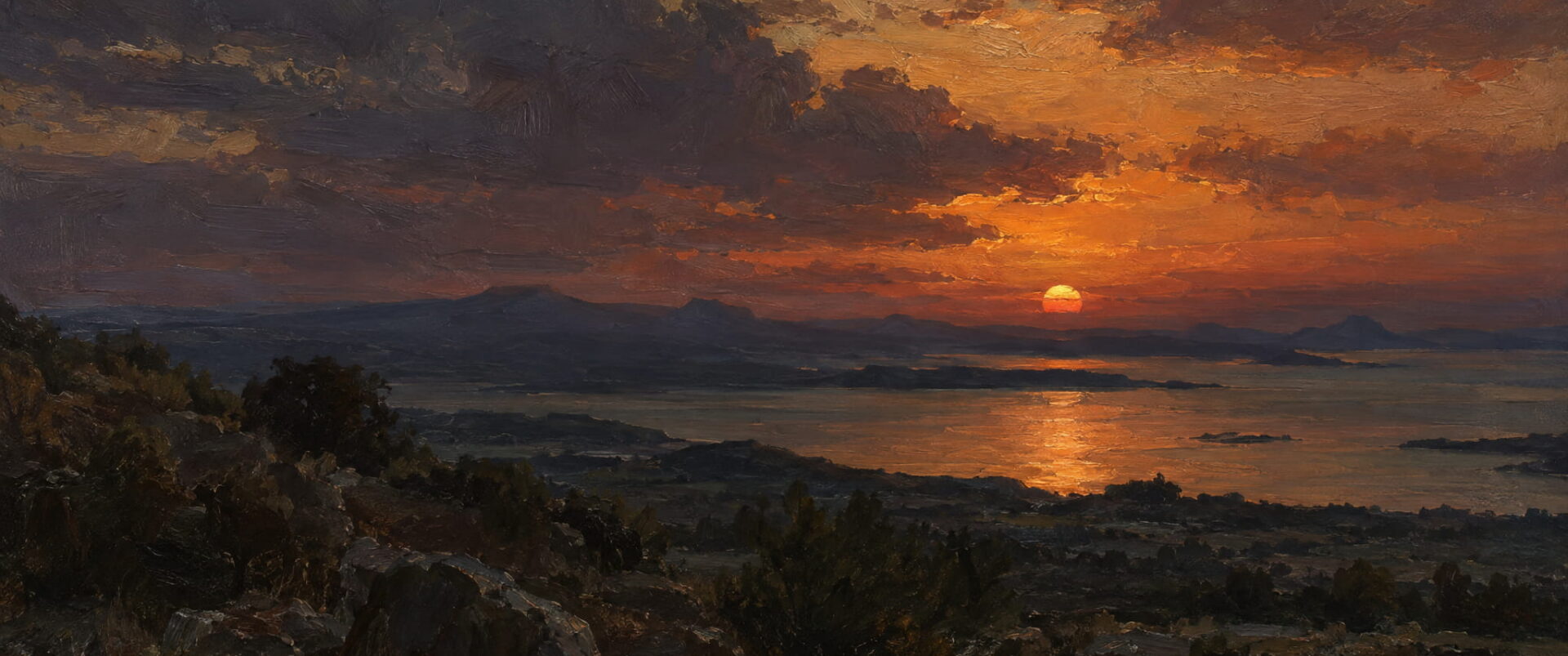 The sun sets over a calm bay seen from a rocky hill, in red and gold.