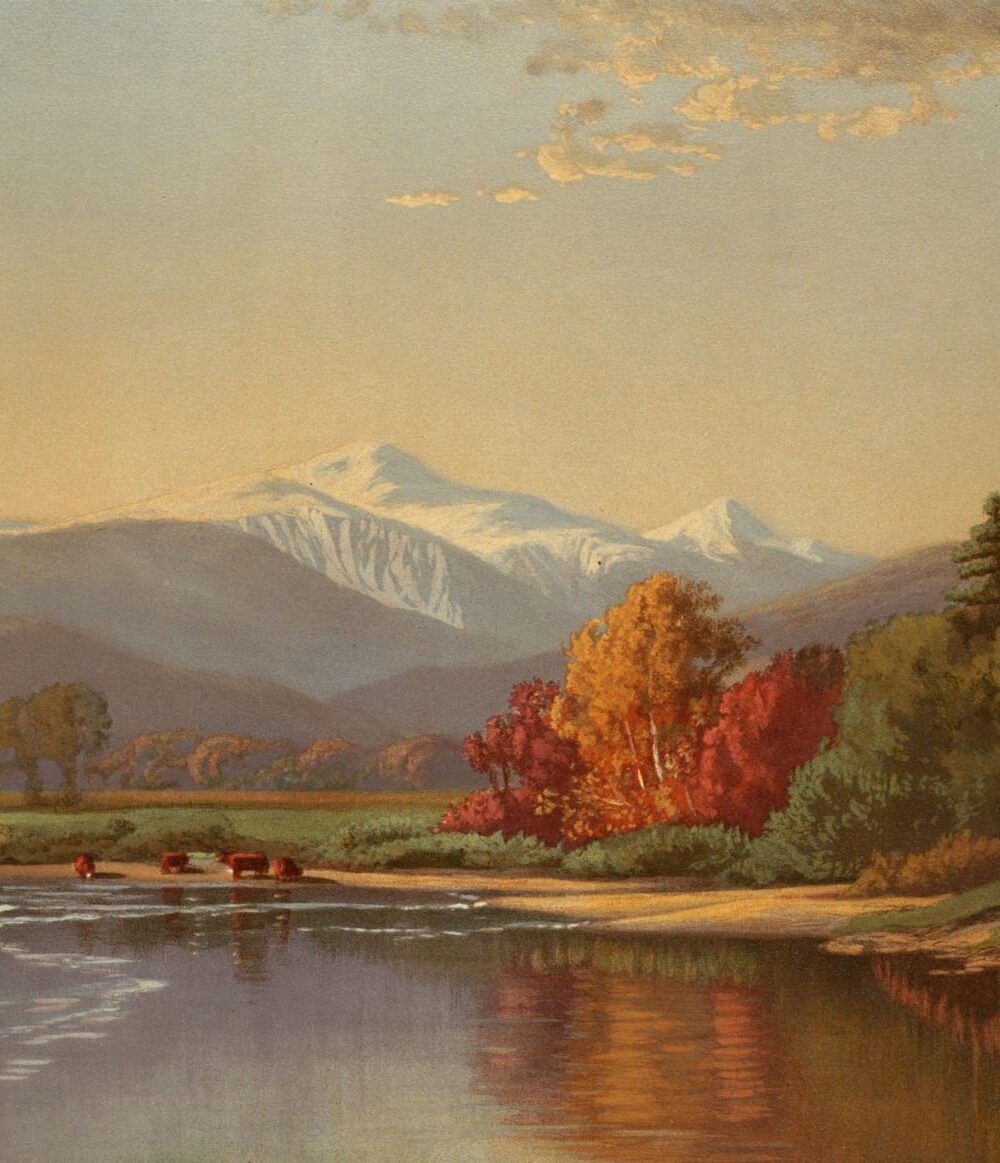 A river bends between red and gold trees toward a snowy mountain.