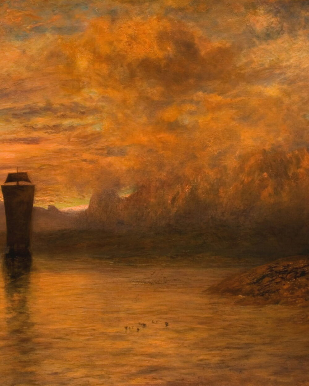 A burning orange sunset behind a harbor tower, reflected in still water.