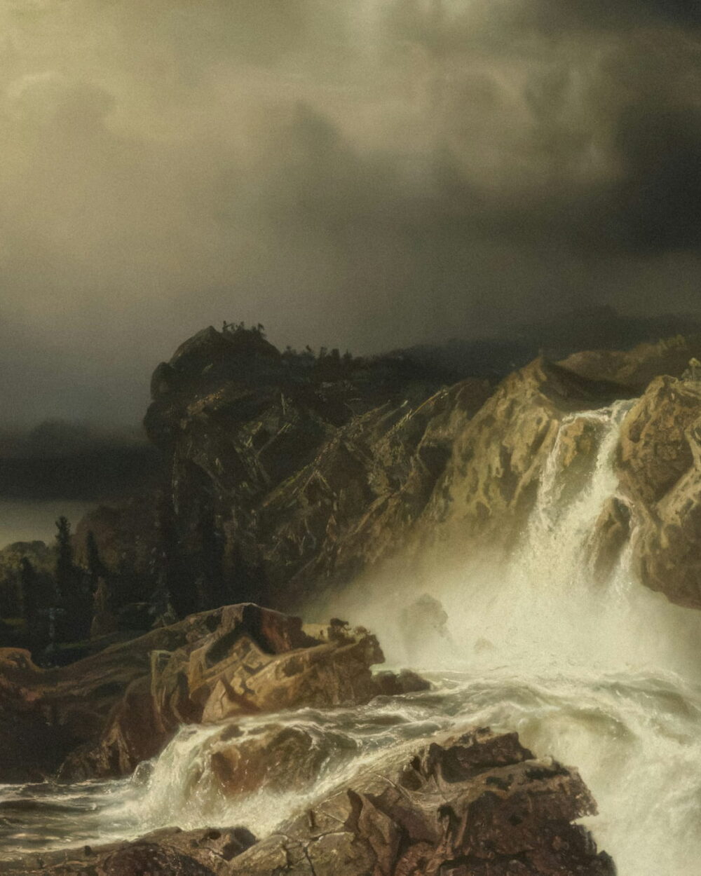 A waterfall pours through rocks below a dark storm and a wooded ridge.
