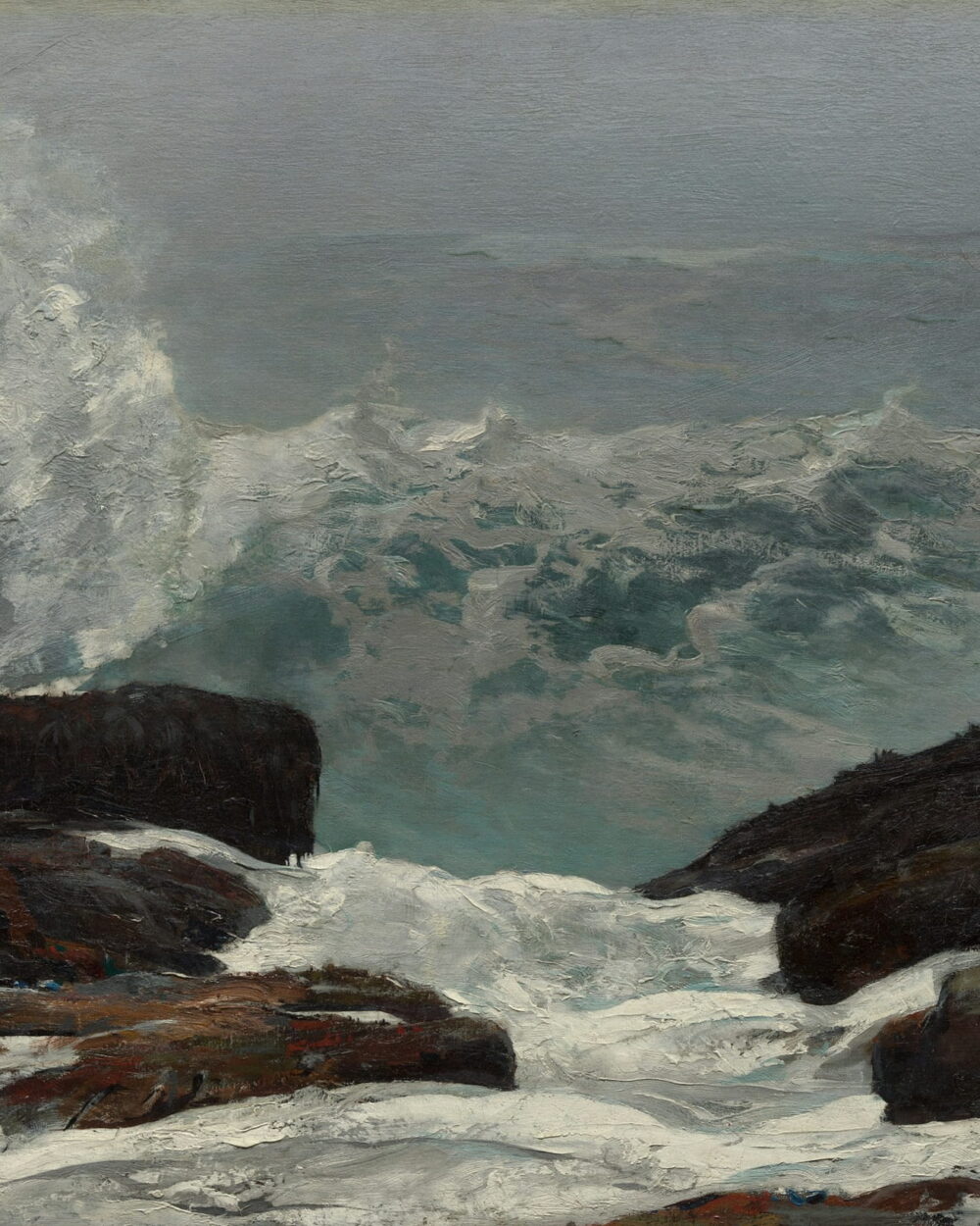 Surf pours between two dark rocks while spray rises behind them.