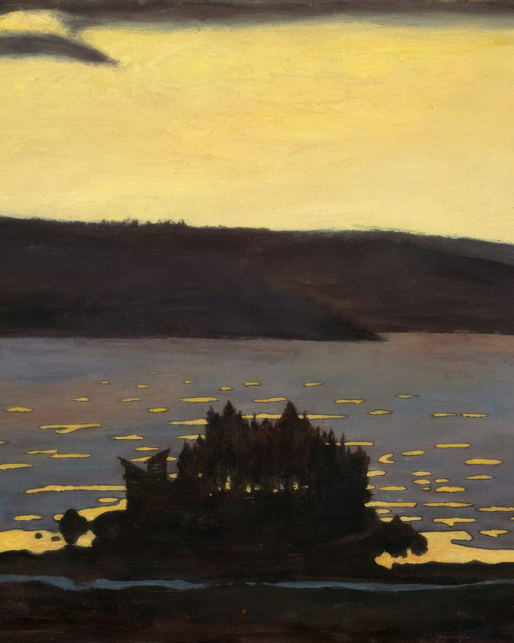 A yellow dusk sky over a dark lake with a small wooded island.