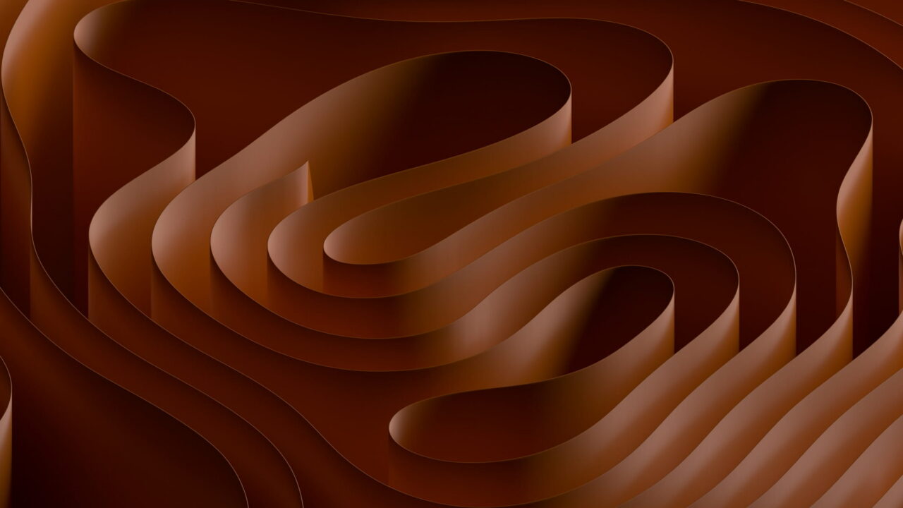 Copper sheets folded in deep layered waves.