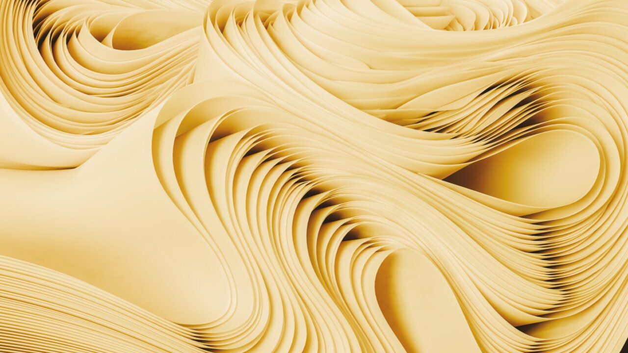 Cream layers rippling in tight waves like stacked paper.