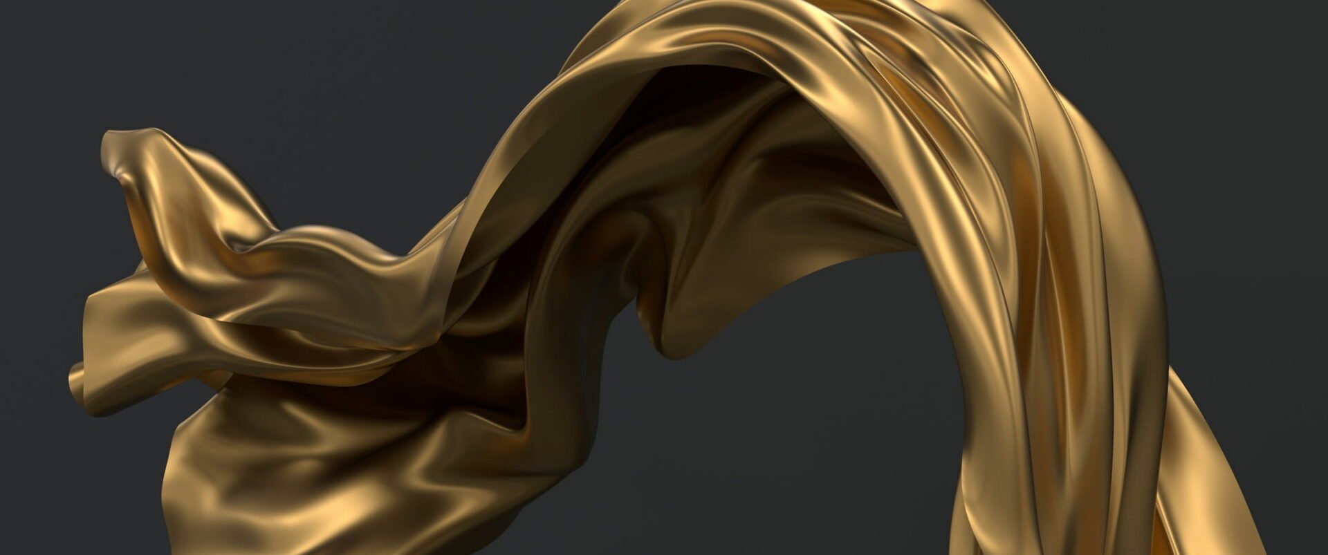 A sheet of gold cloth caught in the air against dark gray.