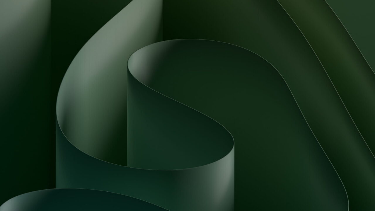 Dark green sheets folded in wide soft curves.