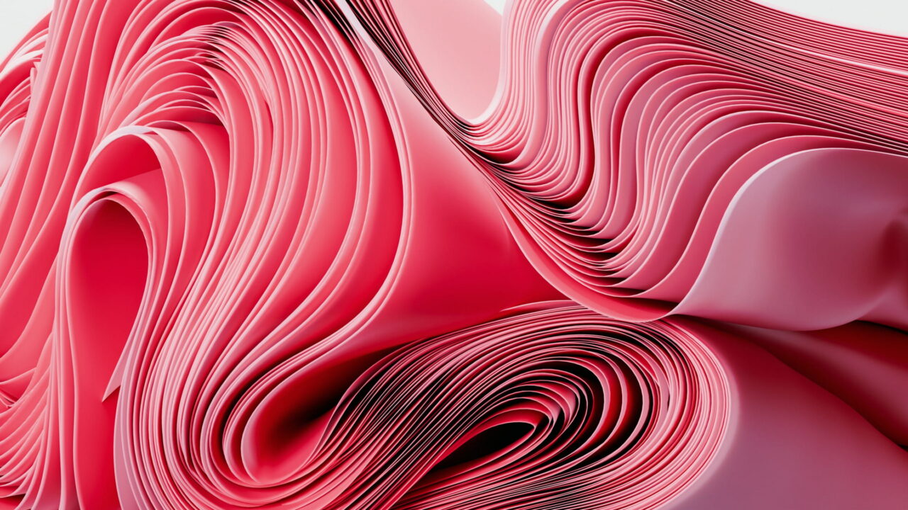 Pink and red layers swirling into a deep curl.