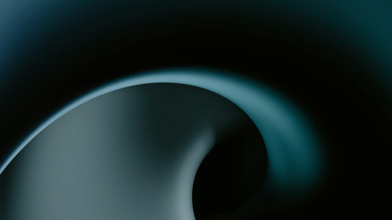 A smooth dark teal form curling like a wave in the dark.