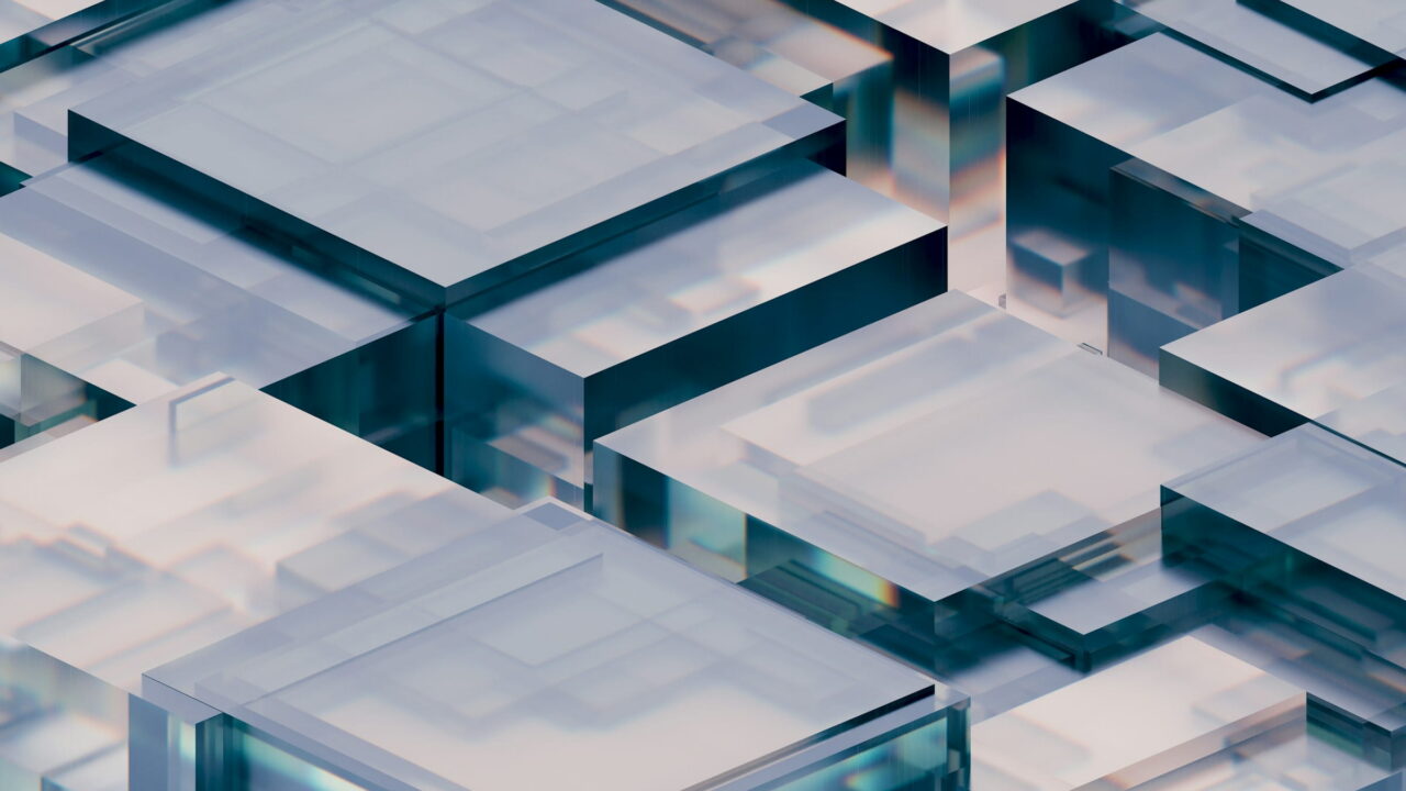 Clear glass blocks stacked in layers, seen from above.