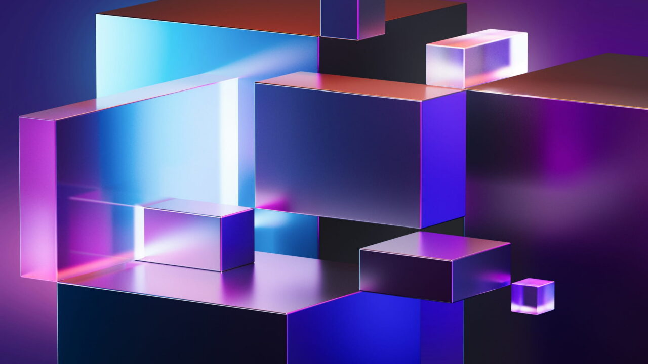 Glass and metal blocks lit blue and violet, stacked like a small city.