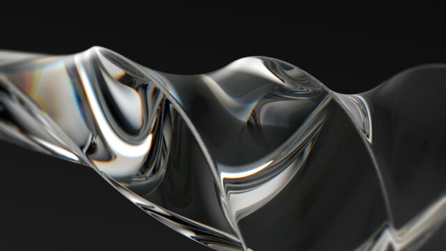 A clear glass ribbon folding across a black frame.