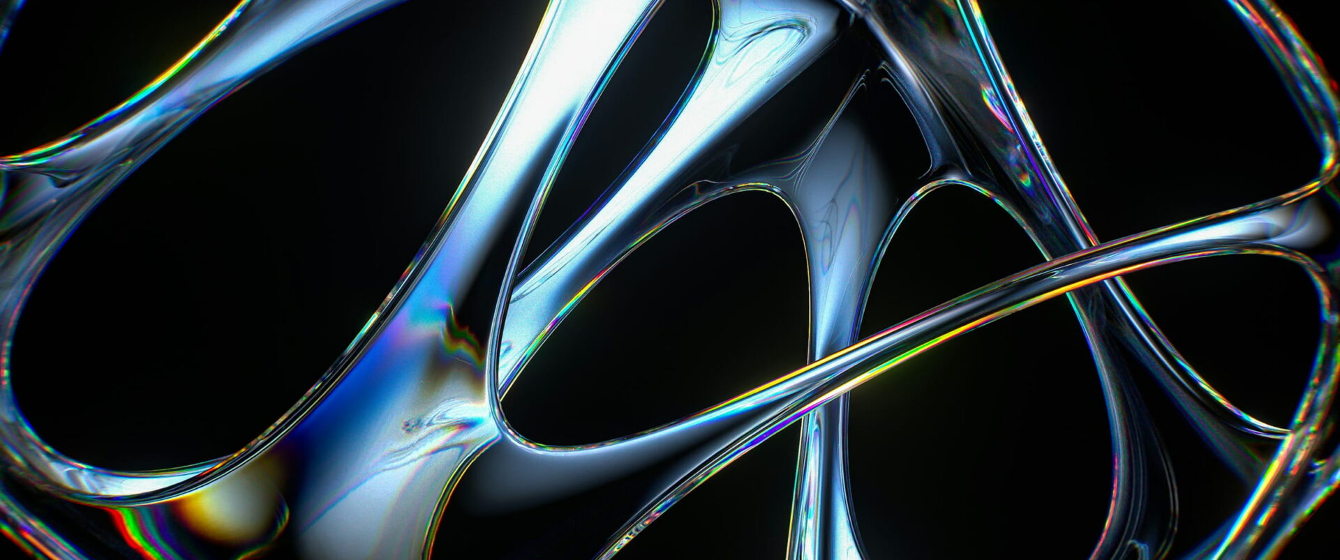 Clear glass loops with rainbow edges crossing on black.