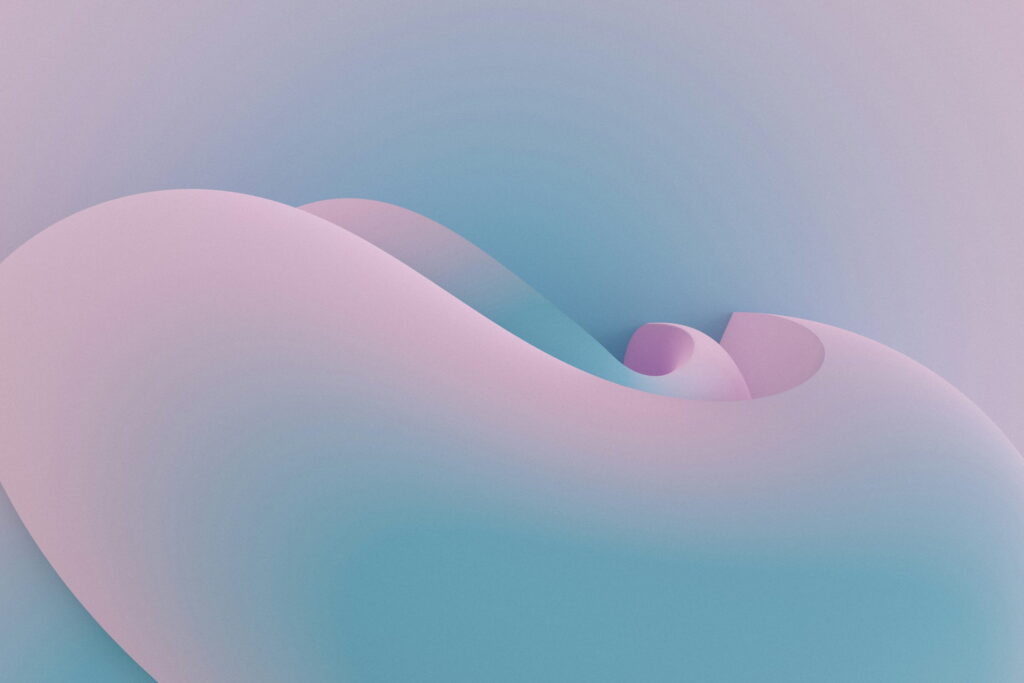 A smooth pale pink and blue dune folding into itself.