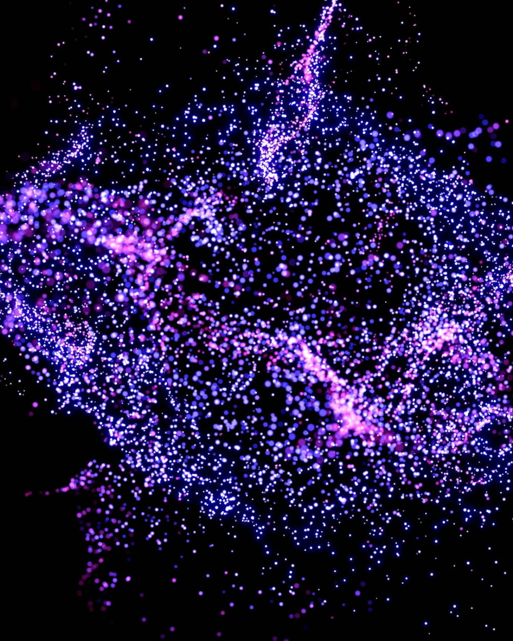 A loose cloud of violet particles spreading on black.