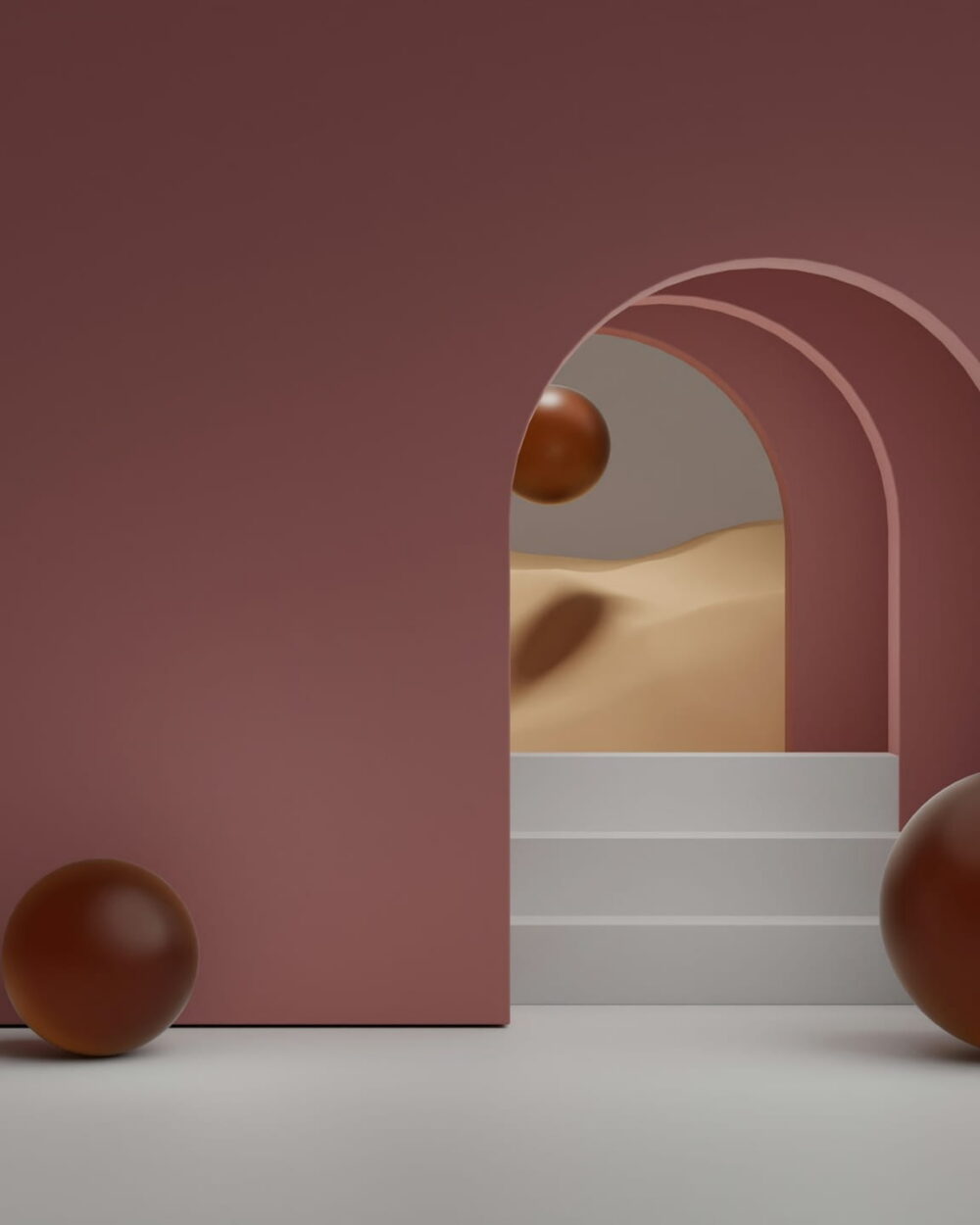A rose-colored wall with nested arches and two glossy brown spheres.