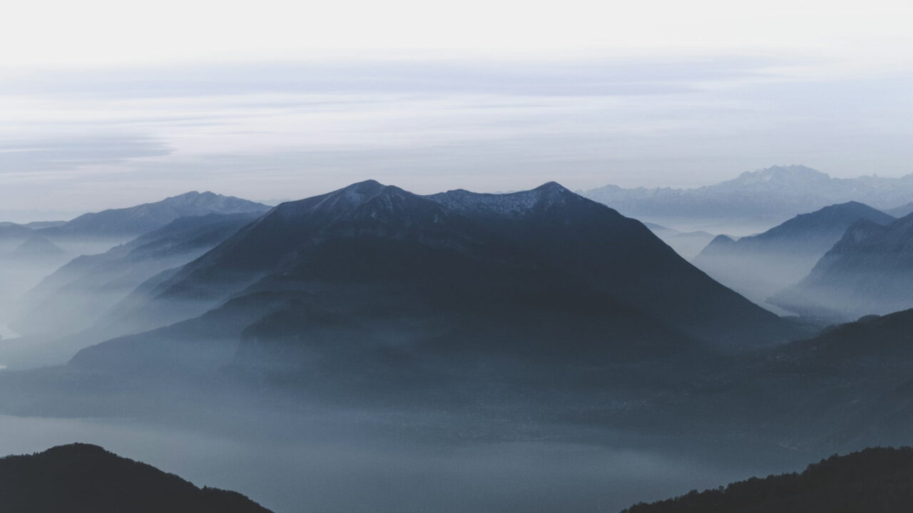Layers of blue mountain ridges fading into mist.