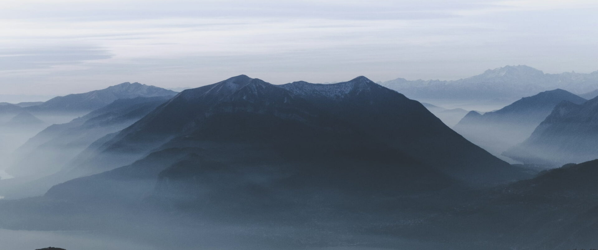 Layers of blue mountain ridges fading into mist.